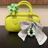Online Borsa lime con charm Borse